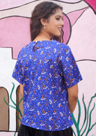 Button at nape of neck to help with dressing