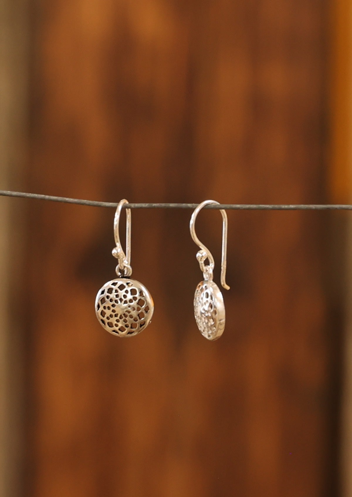 Sterling silver hook earrings with 10mm web-like mandala discs