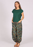 Woman wearing green cotton floral harem pants with green cotton top