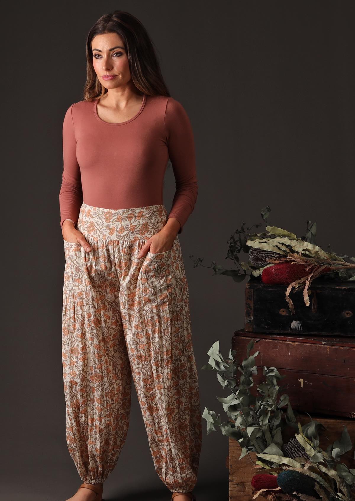 A model wears loose fitting cotton pants