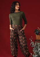 Women wears floral pants with elasticated waist and ankles