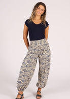 Model wears blue floral print on cream base cotton harem pants