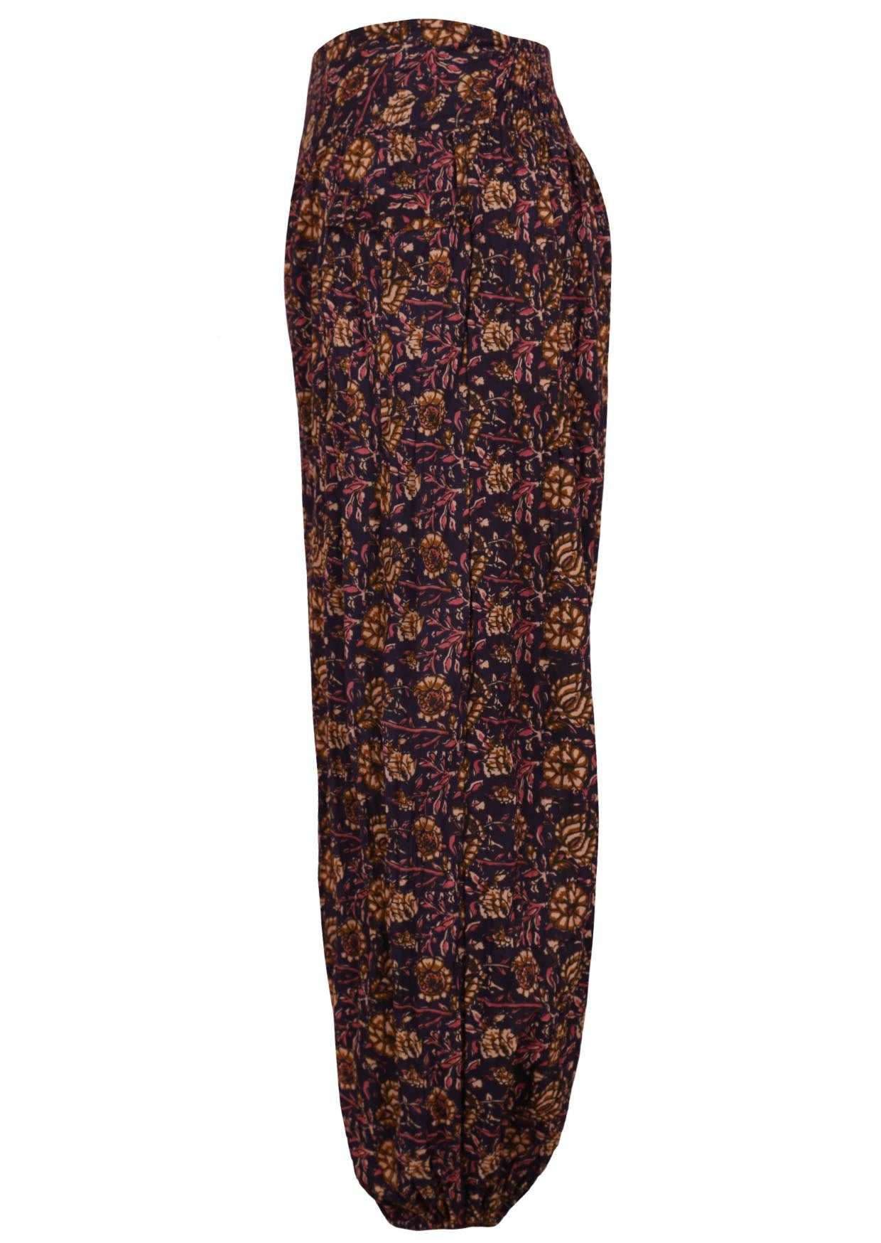 Side image of 100% cotton pants with elastic at the back of waist and ankles. 