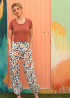 Model wears 100% cotton pants with pockets. 