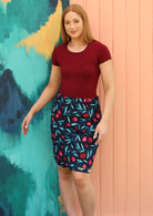 Model wears fruit print cotton reversible skirt