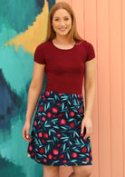 Model wears Pomegranate fruit print cotton reversible skirt