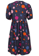 Back image of navy blue spotty print cotton dress with elbow length sleeves.