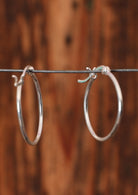 92.5% silver small hoop displayed on a wire.