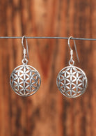 92.5% silver seed of life earrings on a wire for display.