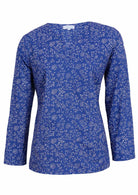 100% cotton top with a white floral pattern on a blue base. 