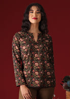 Model in Sophia Blouse Wild Rose black floral cotton women's top
