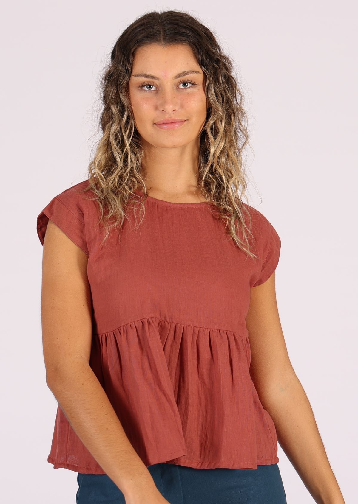 Cotton gauze terracotta coloured top with cap sleeves and ruffle