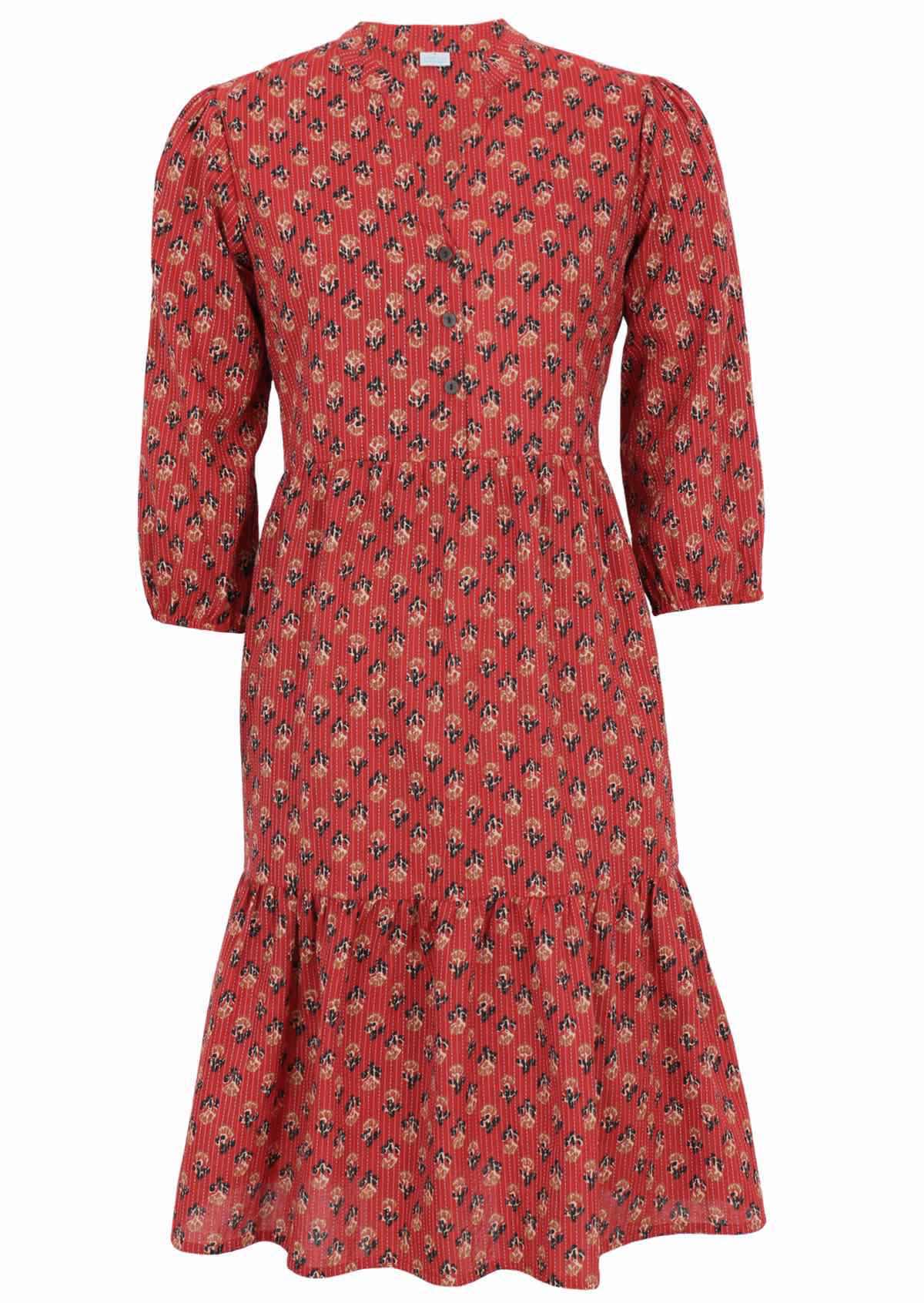 100% cotton dress with decorative florals on a red base. 