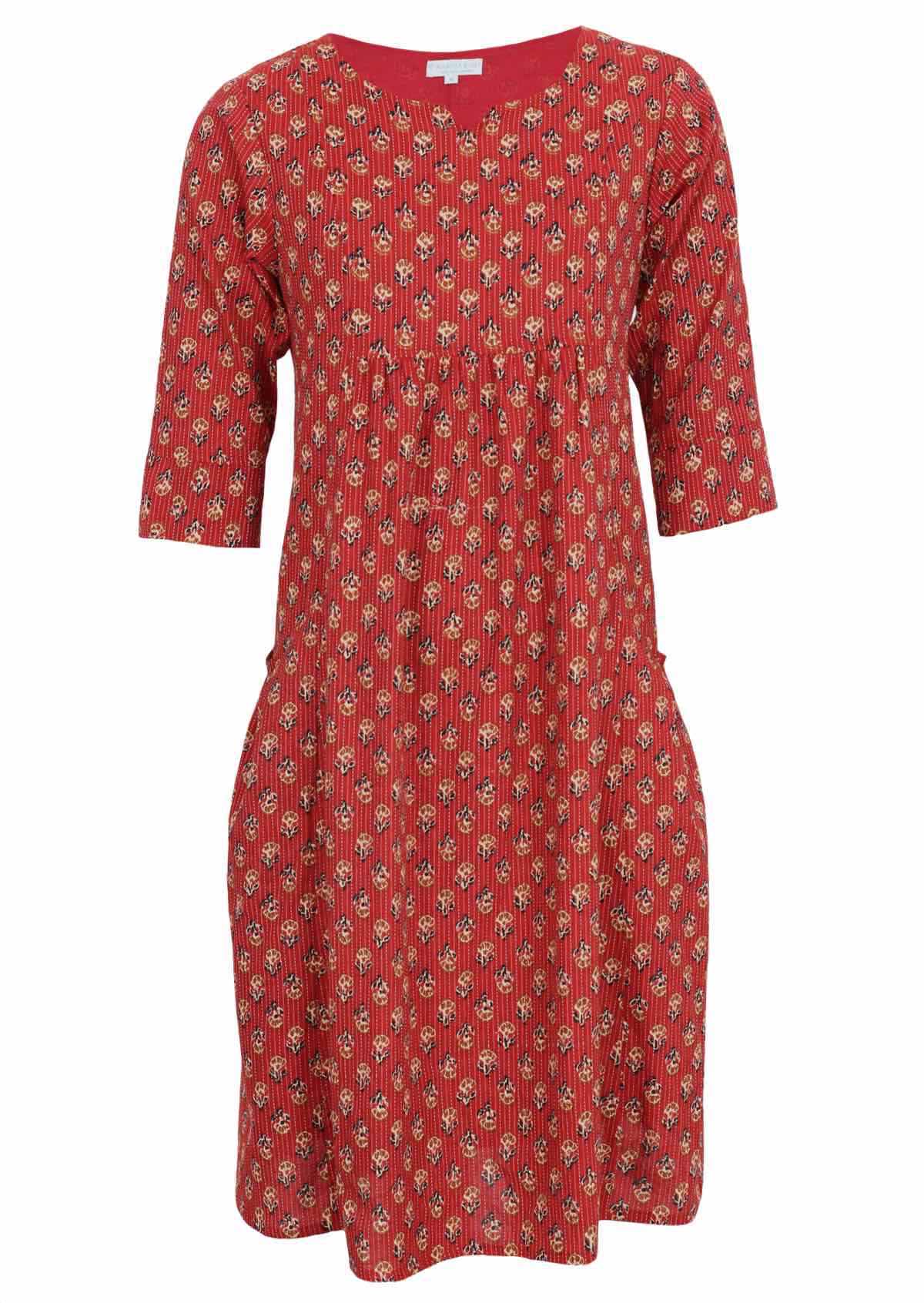 Red floral dress features pin tucks and kantha stitches for visual interest. 
