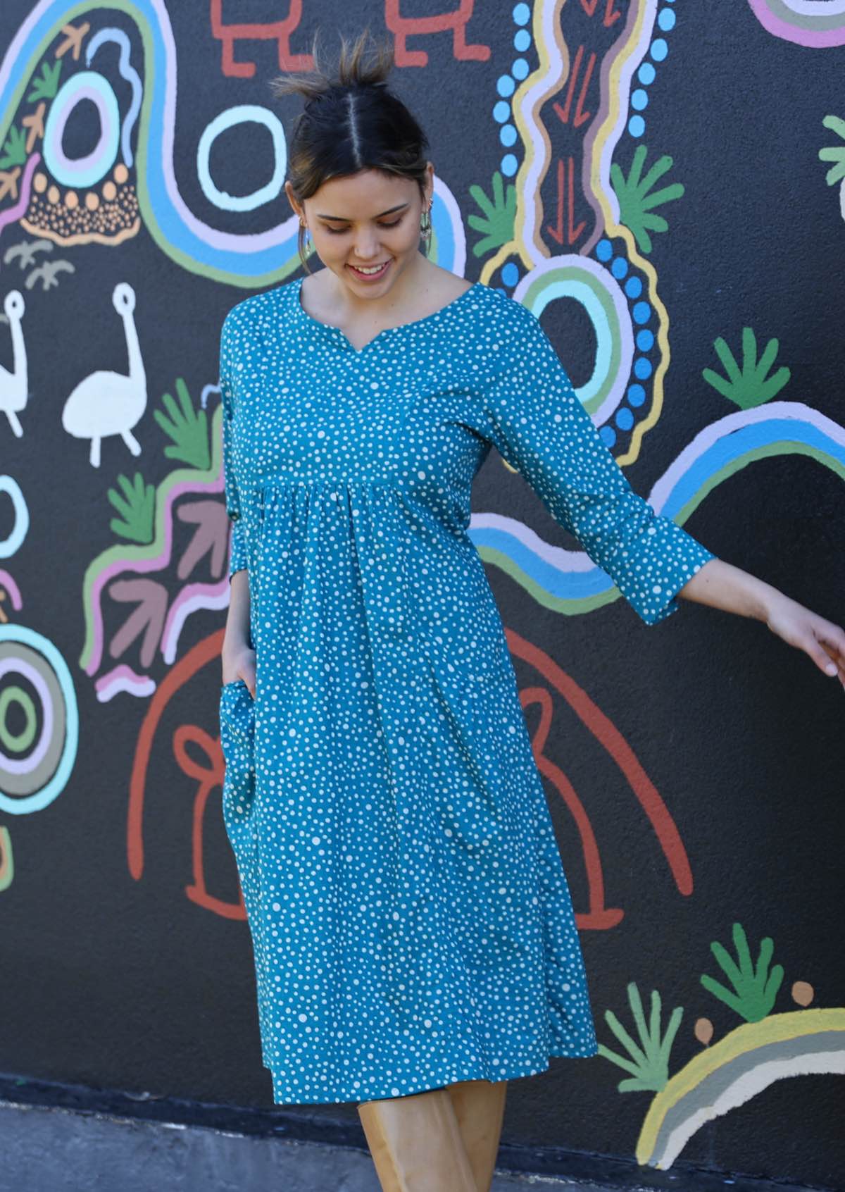 Model in aqua teal coloured cotton 3/4 sleeve cotton dress