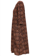 Side view of relaxed fit cotton dress with 3/4 sleeves, pockets and length below the knee.