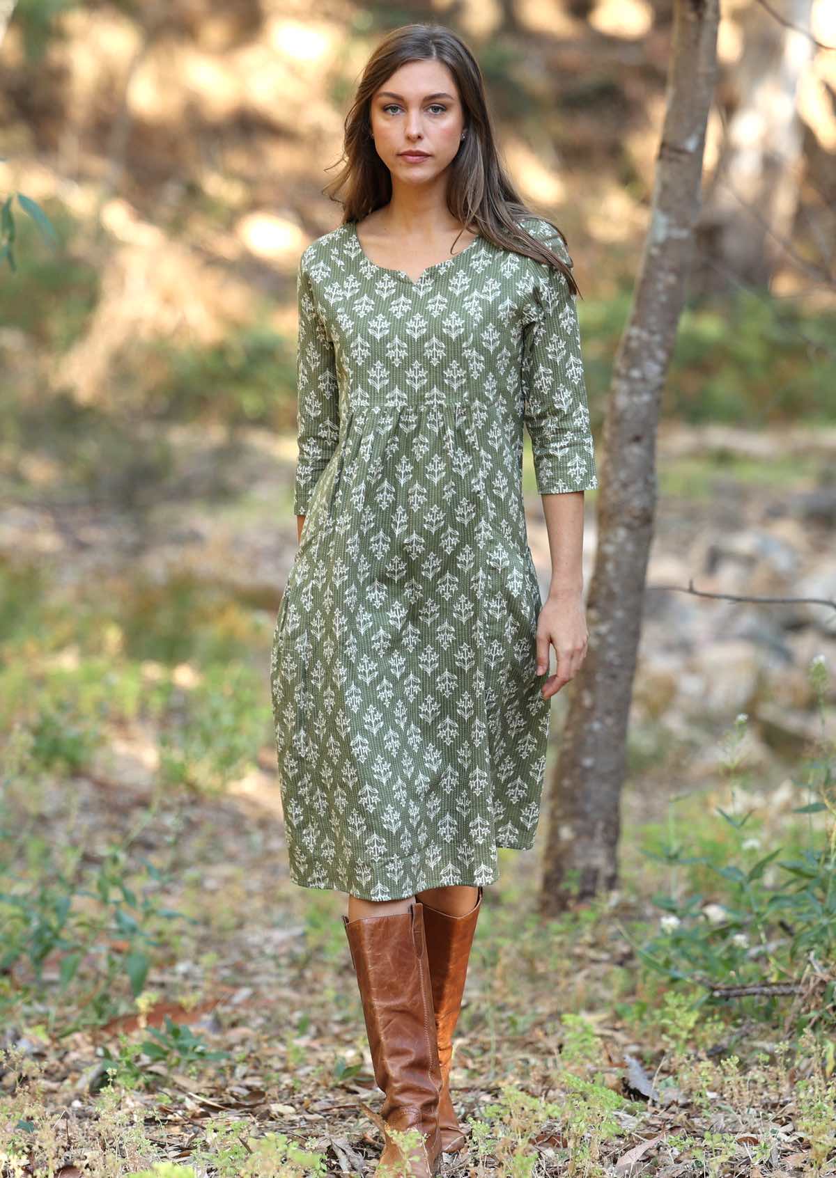 Popular Tilda dress now in this pale green with sweet flowers and kantha stitches