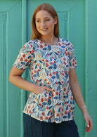 Model wears cotton floral loose fit top with pockets