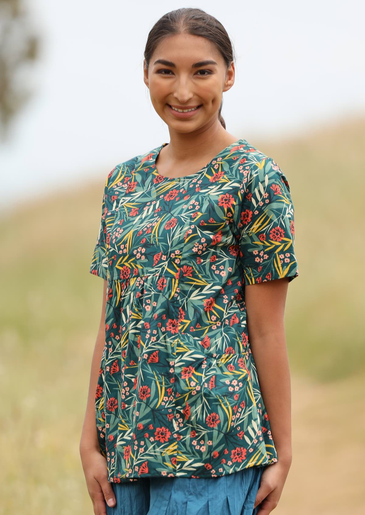 Model wears 100% cotton top with short sleeves. 