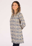 Model wears long sleeve tunic which is perfect for layering. 
