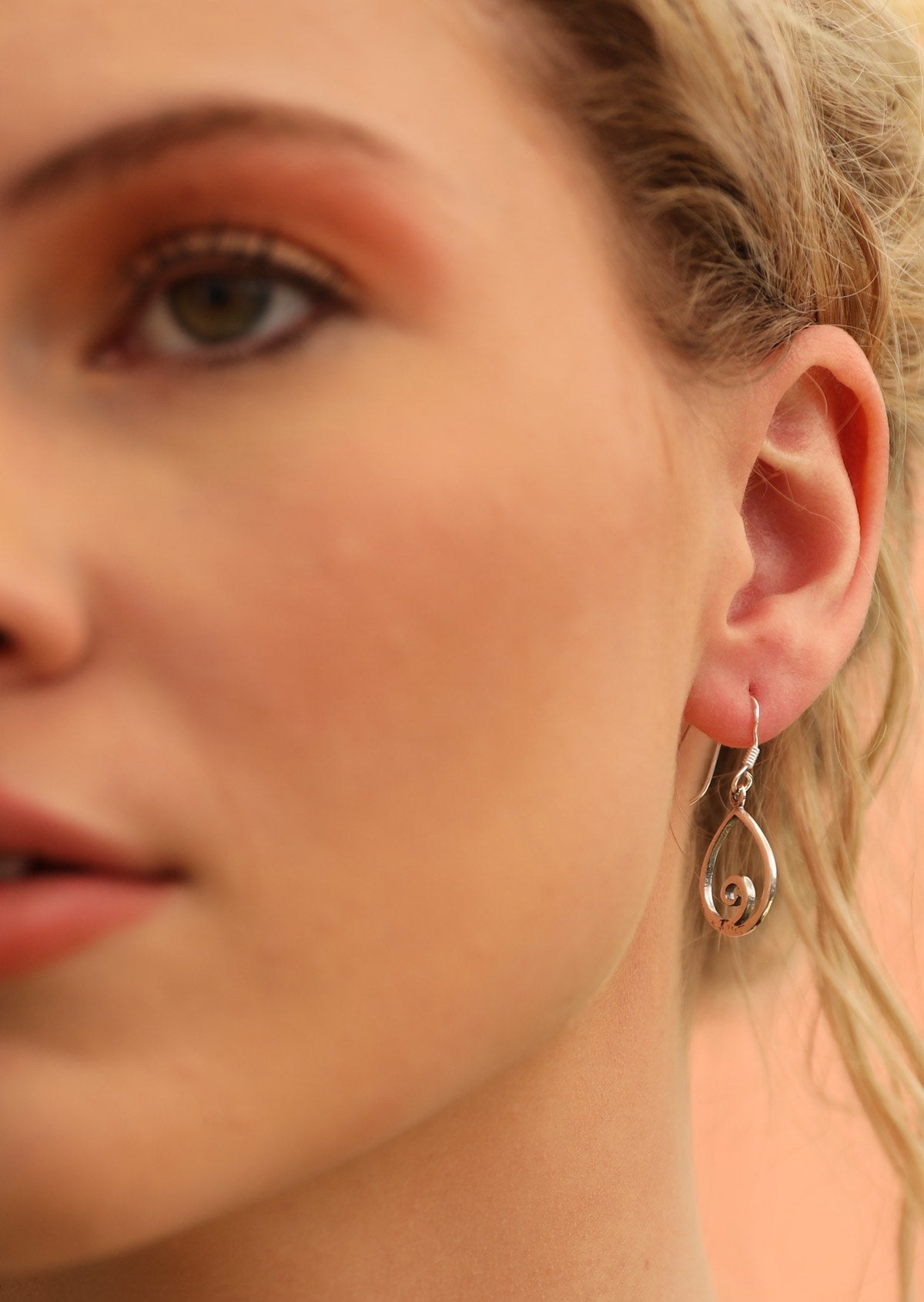 Model wears Tranquil Wave Sterling Silver Hook Earrings