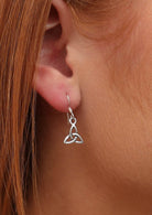 Close up of sterling silver Triquetra hook earrings