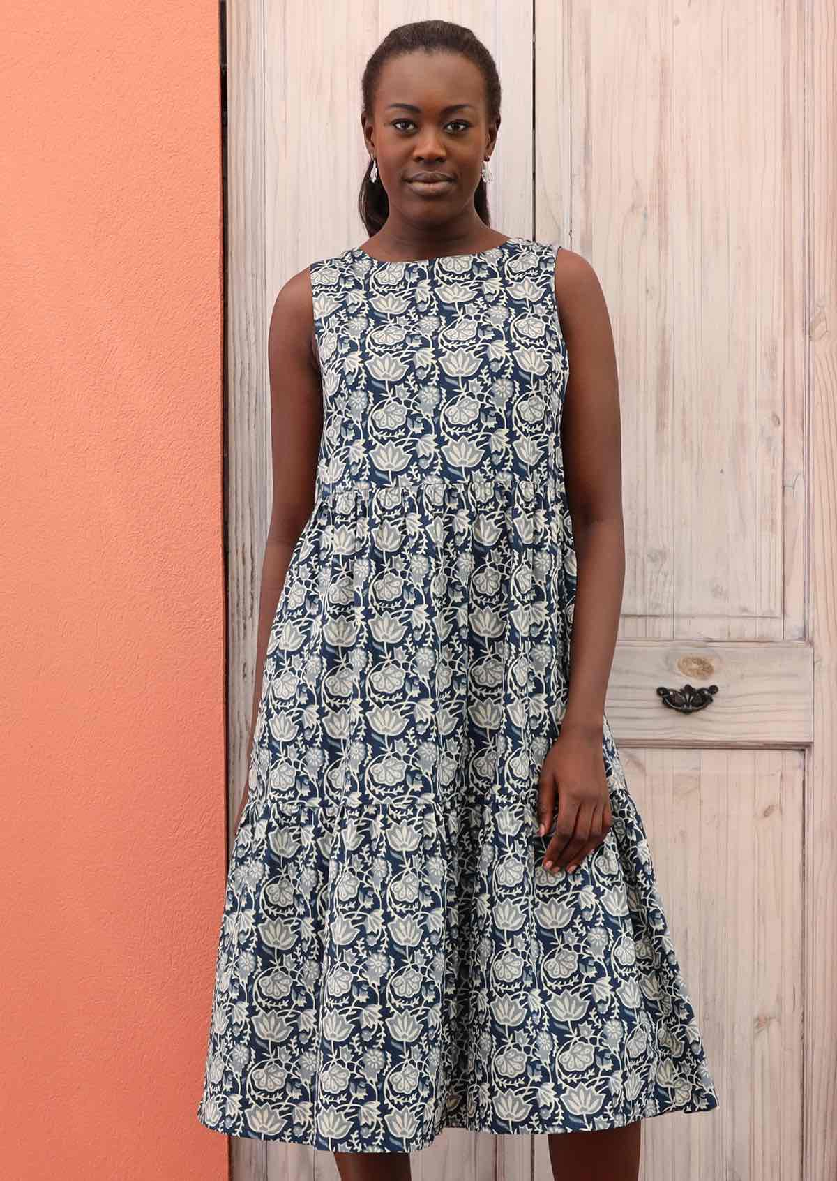 Model wears relaxed fit dress with a round neckline.