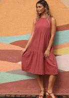 Model wears a 100% double cotton dress with wedge shoes. 