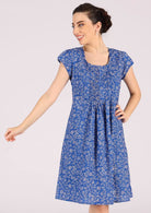 Low round neckline with small pleats across the bodice cotton lined dress