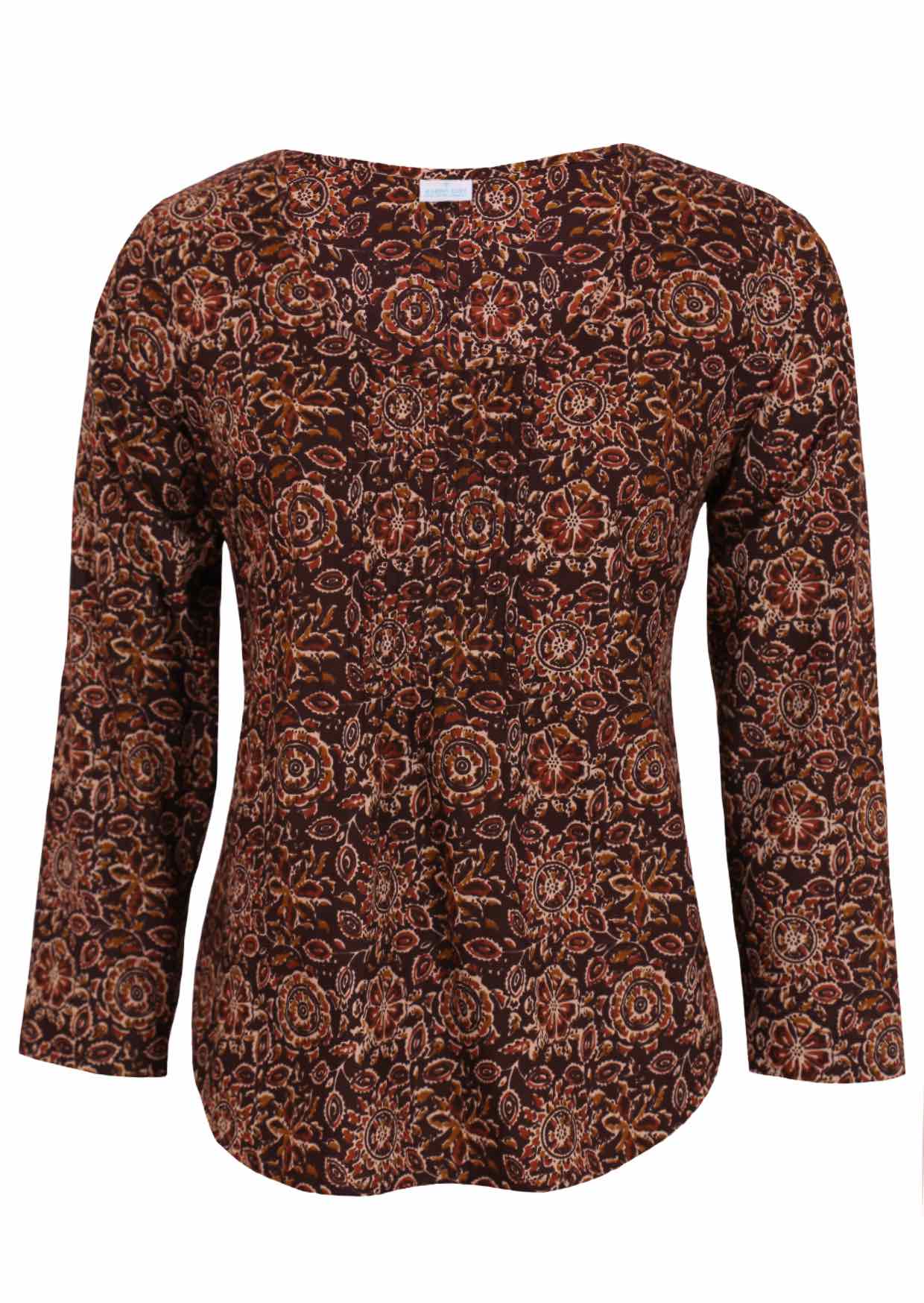 Lightweight 100% cotton top showcasing a simple round neckline, long sleeves and pleats across the bodice.