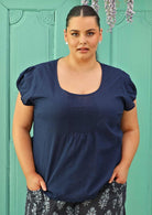 size 18 model wearing navy blue cotton blouse