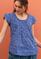 Model wears 100% cotton top with elastic trim in the sleeves. 