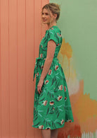 Model wears cotton mint green floral print dress