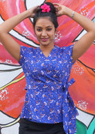 Wrap top with sewn on faux belt with thick side tie