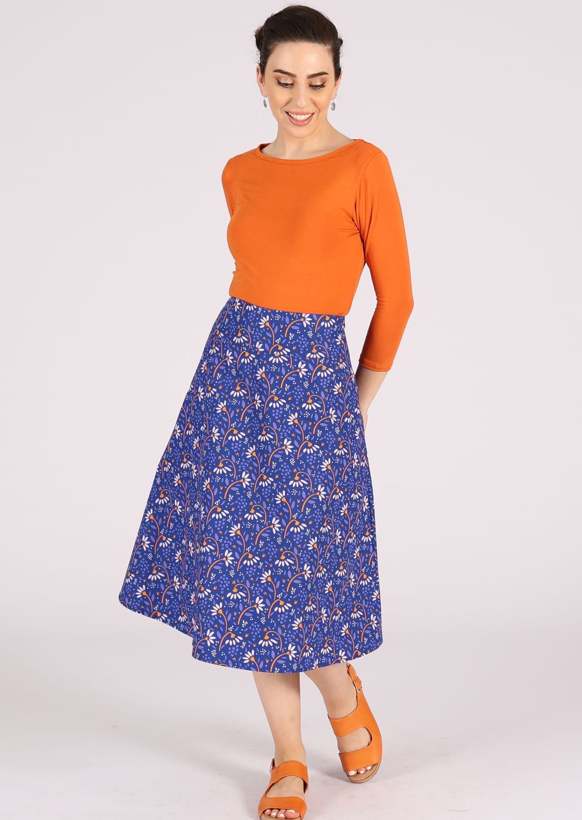Fuller skirt with orange and white floral print on bright blue base