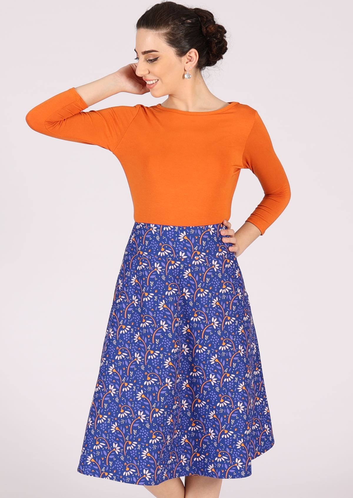 Below knee cotton skirt with funky floral print on blue base