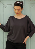 3/4 Sleeve Batwing Top round neckline 3/4 sleeve length batwing loose fitted bodice fits on hips Soft Stretch Rayon dark grey | Karma East Australia
