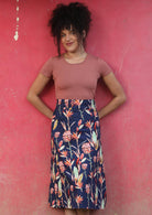 Belt Loop Skirt a-line below the knee length womens skirt with thick waistband and belt loops side zipper 100% cotton navy blue background pink and green toned native floral print | Karma East Australia