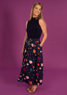model wears 100% cotton shin length skirt with belt loop and pockets.