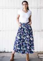 Florals and birds in complemenary blues and browns on a navy blue base cotton skirt