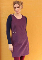 Cord Button Dress round neck sleeveless form fitting bodice a-line skirt adjustable side buttons non-functional shoulder buttons back pockets 100% cotton corduroy purple | Karma East Australia