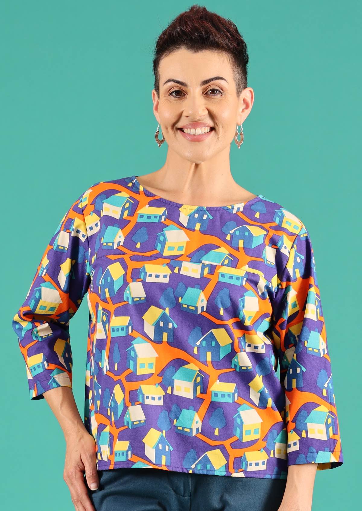 Demi Top Around the Houses orange blue yellow house print 100% cotton loose fit top with decorative buttons down the back | Karma East Australia