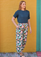 Model wears 100% cotton pant featuring elasticated sides of waistband and side pockets with double cotton teal top.