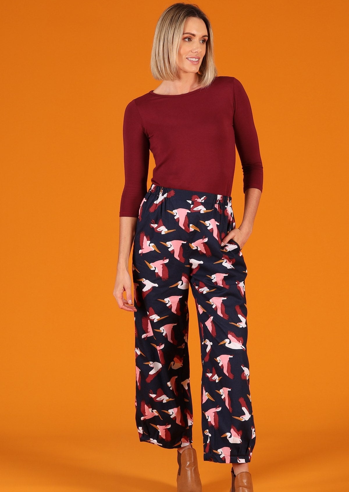 Greta Pants high waisted women's pants elasticated waistband side pockets pleats at side of ankles 100% cotton dark blue base with pink and maroon bird print | Karma East Australia