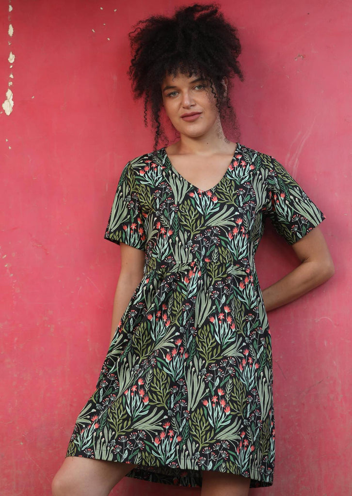 Woman in Harlow Dress Floral 100% Printed Cotton Womens Dress v-neckline short sleeve gathered waistline above knee length skirt with pockets
