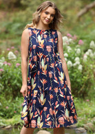 Model in Harper Dress Sleeveless 100% Cotton Dress. Tiered midi dress with pockets