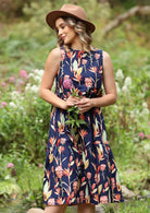 Woman in Bold Printed Cotton Dress with a flower in her hands
