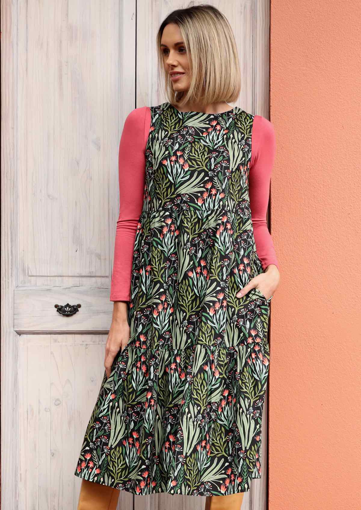 Woman in Harper Dress Cotton Floral Midi Dress sleeveless high neck three tiered cotton midi dress with pockets