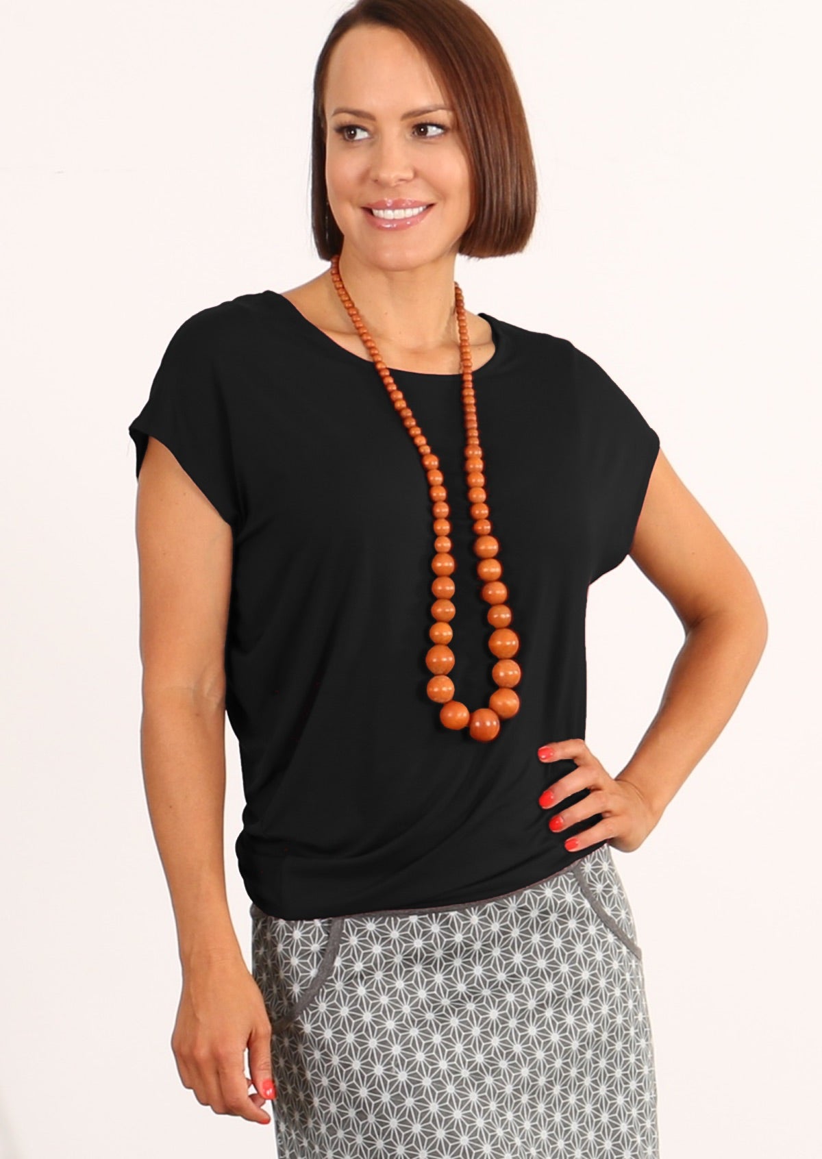 women wearing basic top black with asymmetrical gathering detail