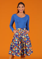 Morgan Skirt full skirt knee length belt loops button through front wait box pleats pockets 100% cotton orange blue yellow house print | Karma East Australia